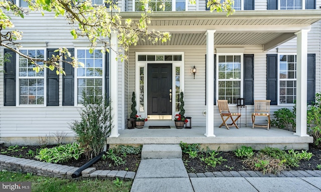 doorway to property featuring covered porch