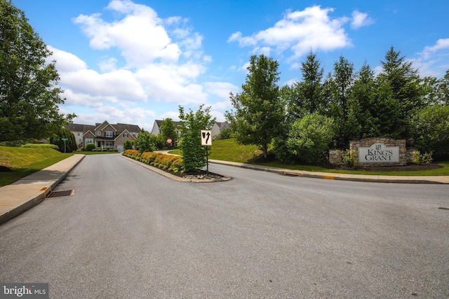 view of road featuring sidewalks and curbs