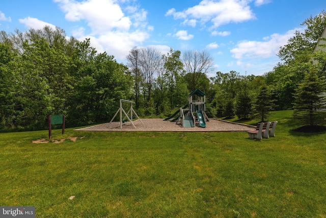 communal playground featuring a lawn