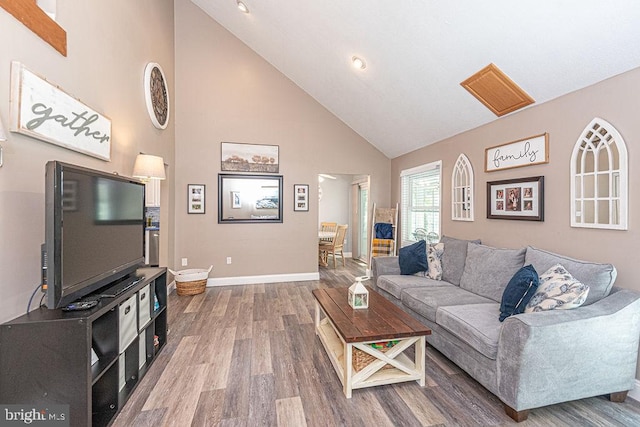 8 Candytuft Ln, Ocean Pines, MD 21811 - living room with wood finished floors, high vaulted ceiling, and baseboards