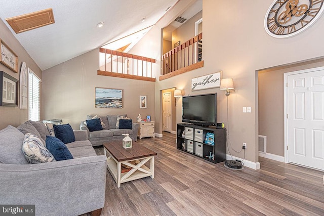 8 Candytuft Ln, Ocean Pines, MD 21811 - living room featuring visible vents, wood finished floors, high vaulted ceiling, and baseboards