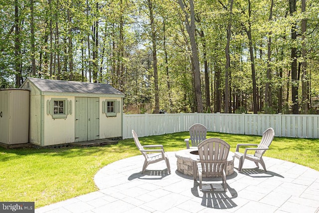 8 Candytuft Ln, Ocean Pines, MD 21811 - view of patio / terrace featuring a storage unit, fence, an outbuilding, and a fire pit
