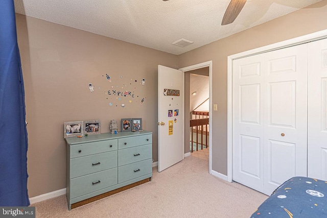 8 Candytuft Ln, Ocean Pines, MD 21811 - bedroom featuring light colored carpet, a closet, baseboards, visible vents, and a textured ceiling