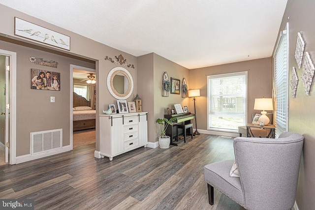 8 Candytuft Ln, Ocean Pines, MD 21811 - sitting room with dark wood finished floors, visible vents, a healthy amount of sunlight, and baseboards
