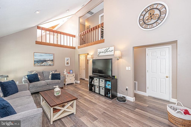 8 Candytuft Ln, Ocean Pines, MD 21811 - living area featuring wood finished floors, high vaulted ceiling, and baseboards