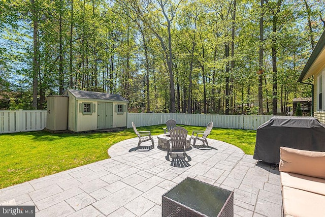8 Candytuft Ln, Ocean Pines, MD 21811 - view of patio with an outbuilding, area for grilling, a storage unit, and a fenced backyard