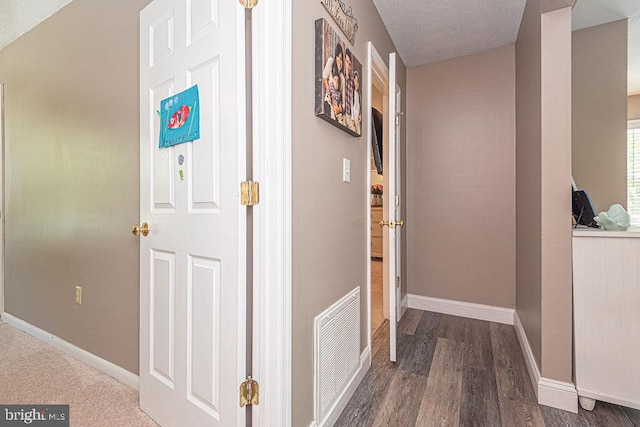 8 Candytuft Ln, Ocean Pines, MD 21811 - hall with a textured ceiling, visible vents, wood finished floors, and baseboards