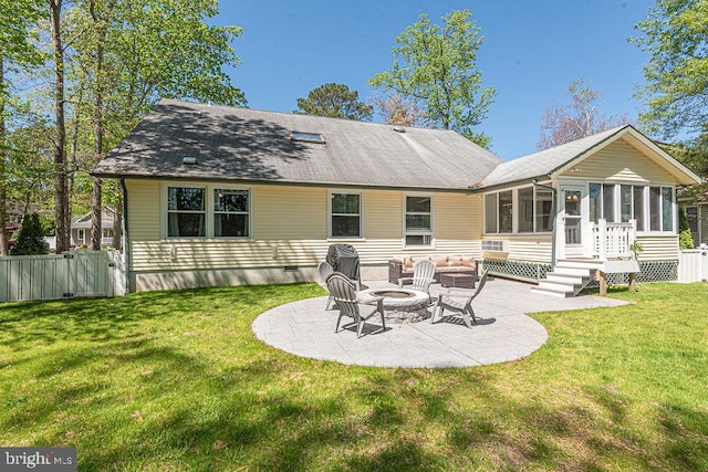 8 Candytuft Ln, Ocean Pines, MD 21811 - back of property with a gate, a fire pit, a patio, a sunroom, and a lawn