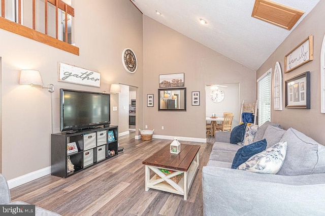 8 Candytuft Ln, Ocean Pines, MD 21811 - living room with high vaulted ceiling, baseboards, wood finished floors, and visible vents