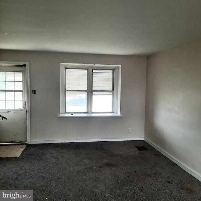 6937 Stenton Ave, Philadelphia, PA 19138 - interior space featuring visible vents, baseboards, and dark carpet