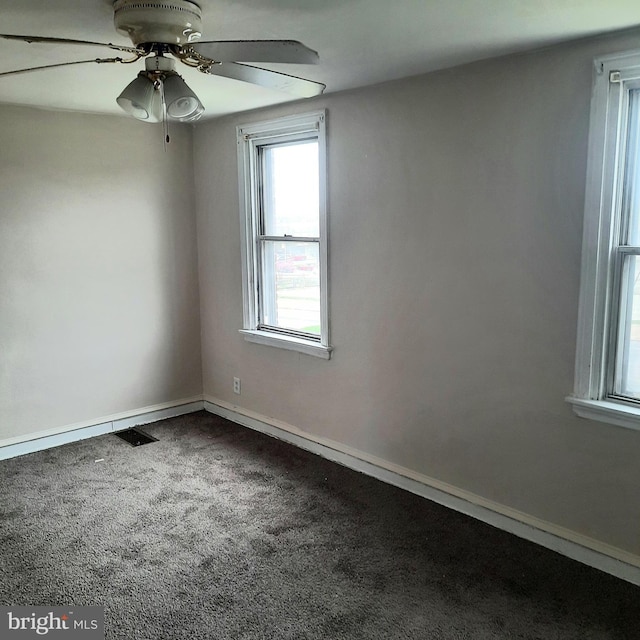 6937 Stenton Ave, Philadelphia, PA 19138 - spare room with visible vents, baseboards, dark carpet, and ceiling fan