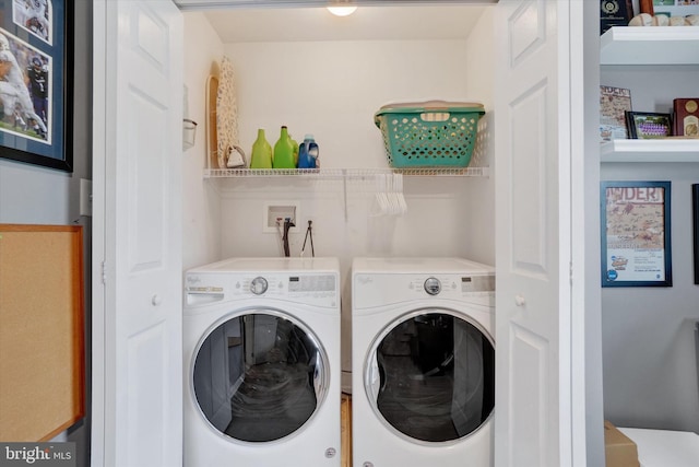 laundry area with washing machine and dryer