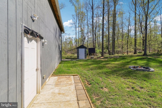 5160 Miller Hill Rd, La Plata, MD 20646 - view of yard with an outdoor fire pit, an outdoor structure, and a storage shed