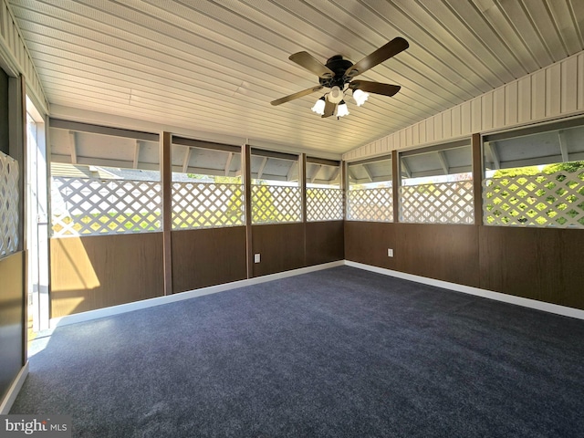 unfurnished sunroom featuring ceiling fan