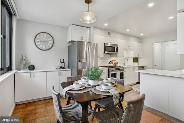 dining room featuring recessed lighting and visible vents