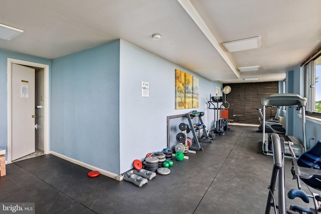 exercise room with baseboards