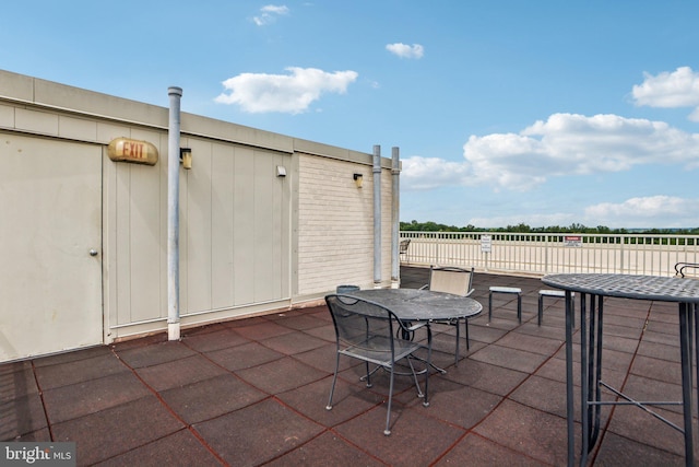 view of patio featuring outdoor dining area