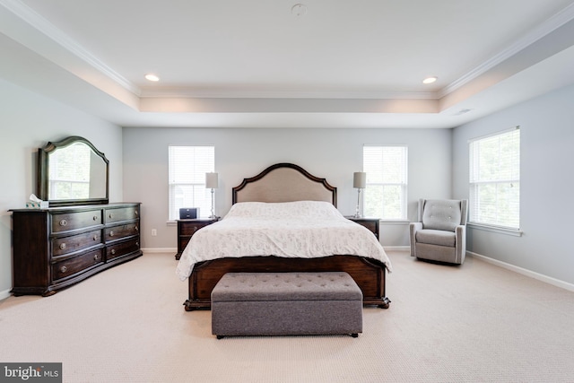 carpeted bedroom featuring ornamental molding, a tray ceiling, and recessed lighting