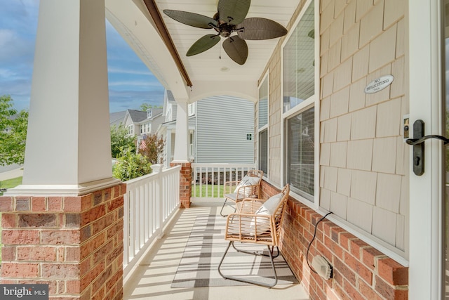 balcony with a ceiling fan and covered porch