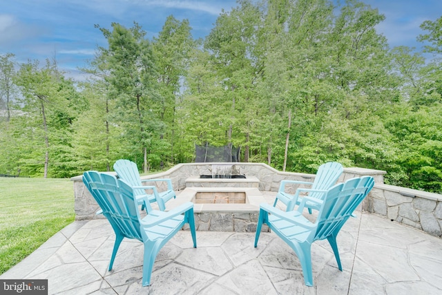 view of patio / terrace with a forest view