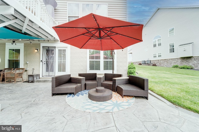 view of patio / terrace featuring central AC and outdoor lounge area