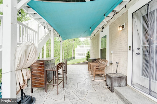 view of patio / terrace featuring outdoor dry bar