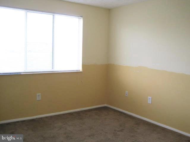 730 Heather Ridge Dr Unit G, Frederick, MD 21702 - carpeted empty room with baseboards