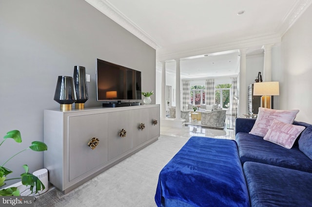 living area featuring ornamental molding and ornate columns