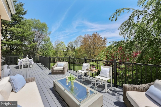 wooden deck featuring outdoor lounge area and outdoor dining space