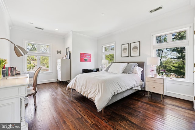 bedroom featuring visible vents, ornamental molding, and multiple windows