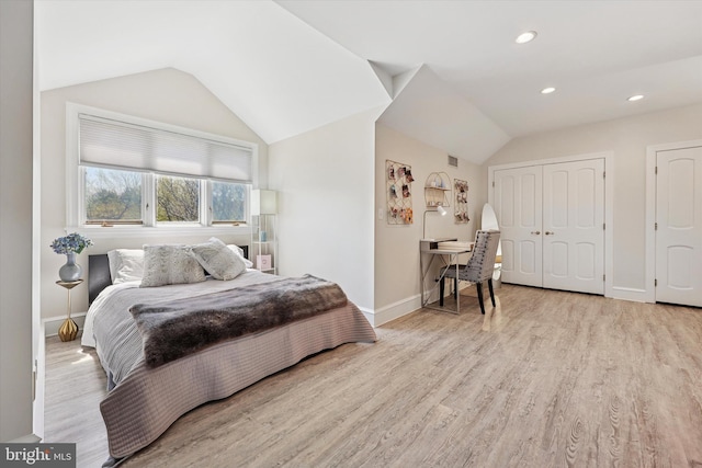 bedroom with recessed lighting, baseboards, vaulted ceiling, and wood finished floors