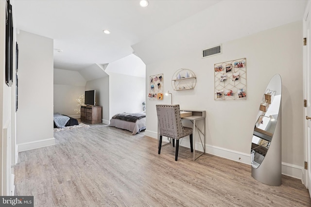 bedroom featuring visible vents, wood finished floors, baseboards, recessed lighting, and vaulted ceiling