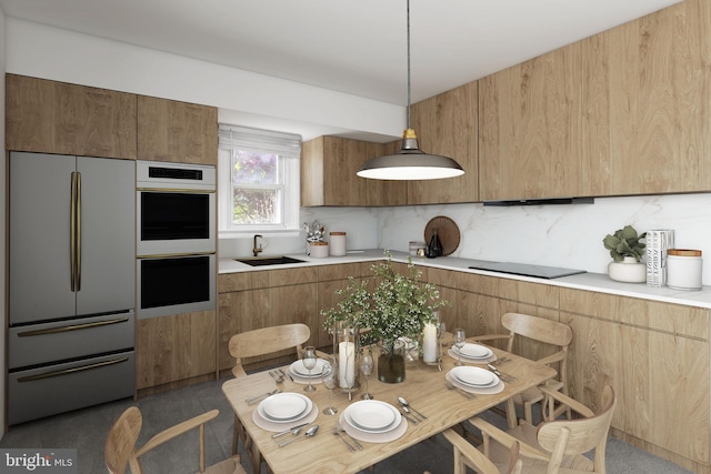 kitchen featuring light countertops, refrigerator, tasteful backsplash, and double oven