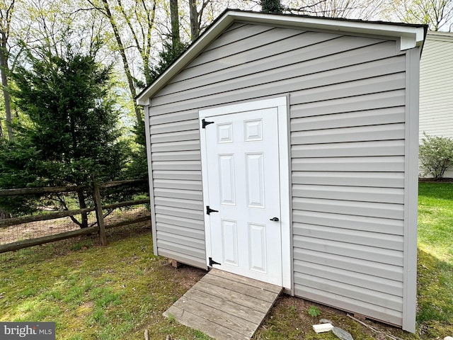 view of shed with fence