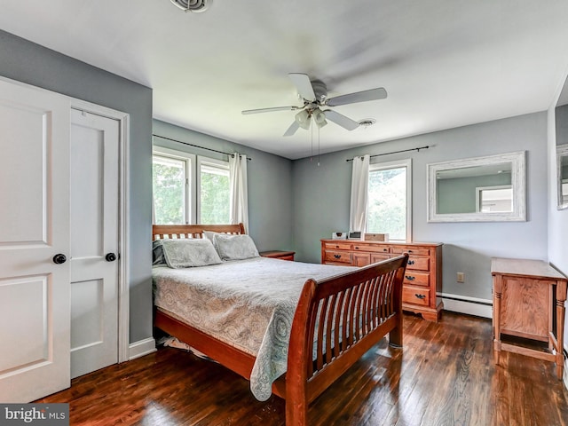 724 Webb St, Aberdeen, MD 21001 - bedroom with a baseboard radiator, multiple windows, dark wood finished floors, and ceiling fan