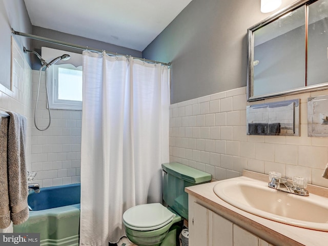 724 Webb St, Aberdeen, MD 21001 - bathroom featuring tile walls, shower / bathtub combination with curtain, vanity, and wainscoting