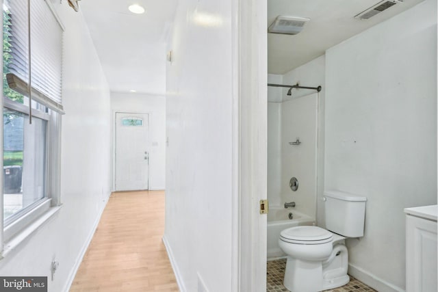 511 9th St, New Castle, DE 19720 - full bathroom with toilet,  shower combination, wood finished floors, visible vents, and baseboards