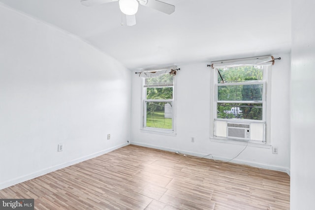 511 9th St, New Castle, DE 19720 - spare room featuring lofted ceiling, baseboards, cooling unit, ceiling fan, and wood finished floors