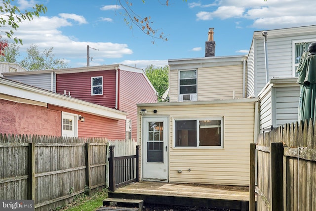 511 9th St, New Castle, DE 19720 - back of house featuring a fenced backyard and a chimney