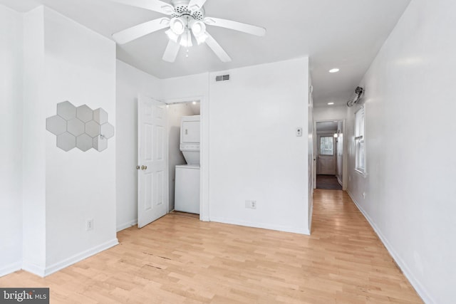 511 9th St, New Castle, DE 19720 - unfurnished bedroom featuring recessed lighting, baseboards, visible vents, stacked washer and dryer, and light wood-type flooring