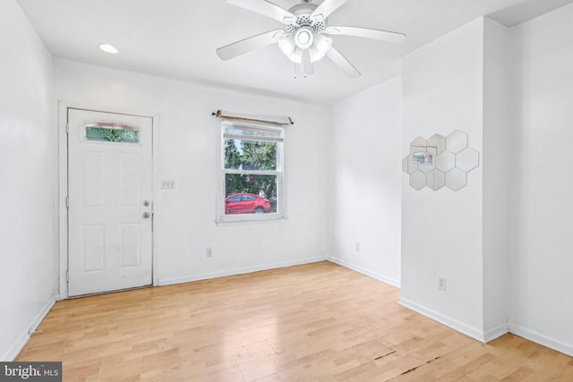511 9th St, New Castle, DE 19720 - foyer entrance with light wood-style floors, baseboards, and a ceiling fan