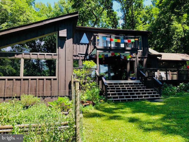 exterior space with a lawn and stairway