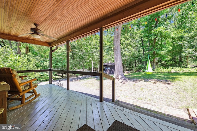 wooden deck featuring ceiling fan