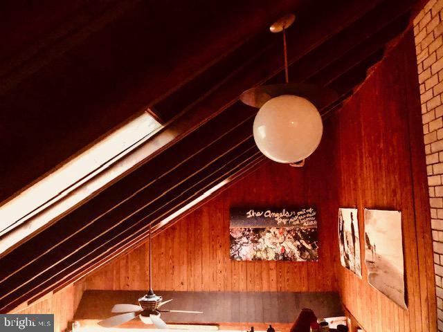 details featuring wood walls