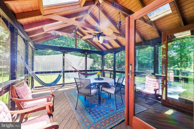 deck with a gazebo, a ceiling fan, and outdoor dining space