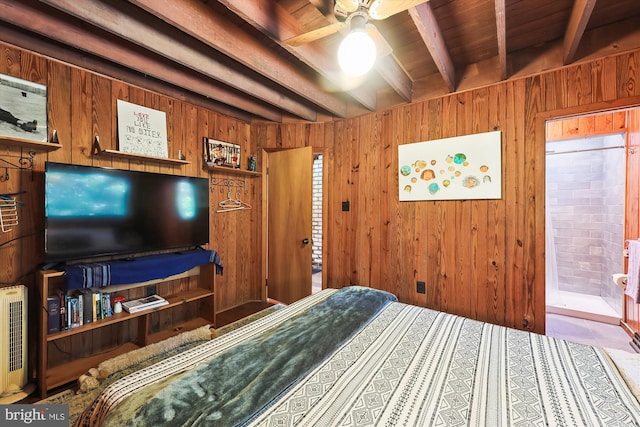bedroom with beamed ceiling and wood walls