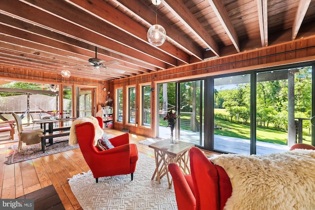 sunroom with beamed ceiling