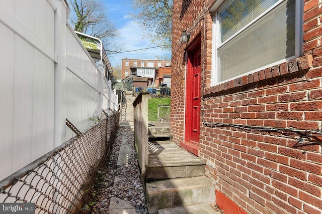 view of home's exterior featuring fence