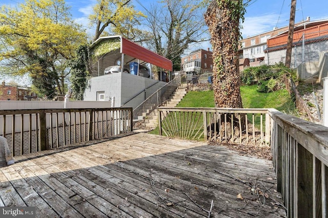 wooden terrace featuring fence