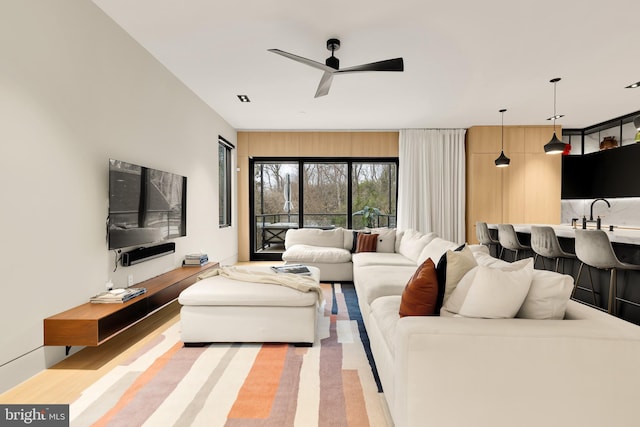 living area featuring ceiling fan